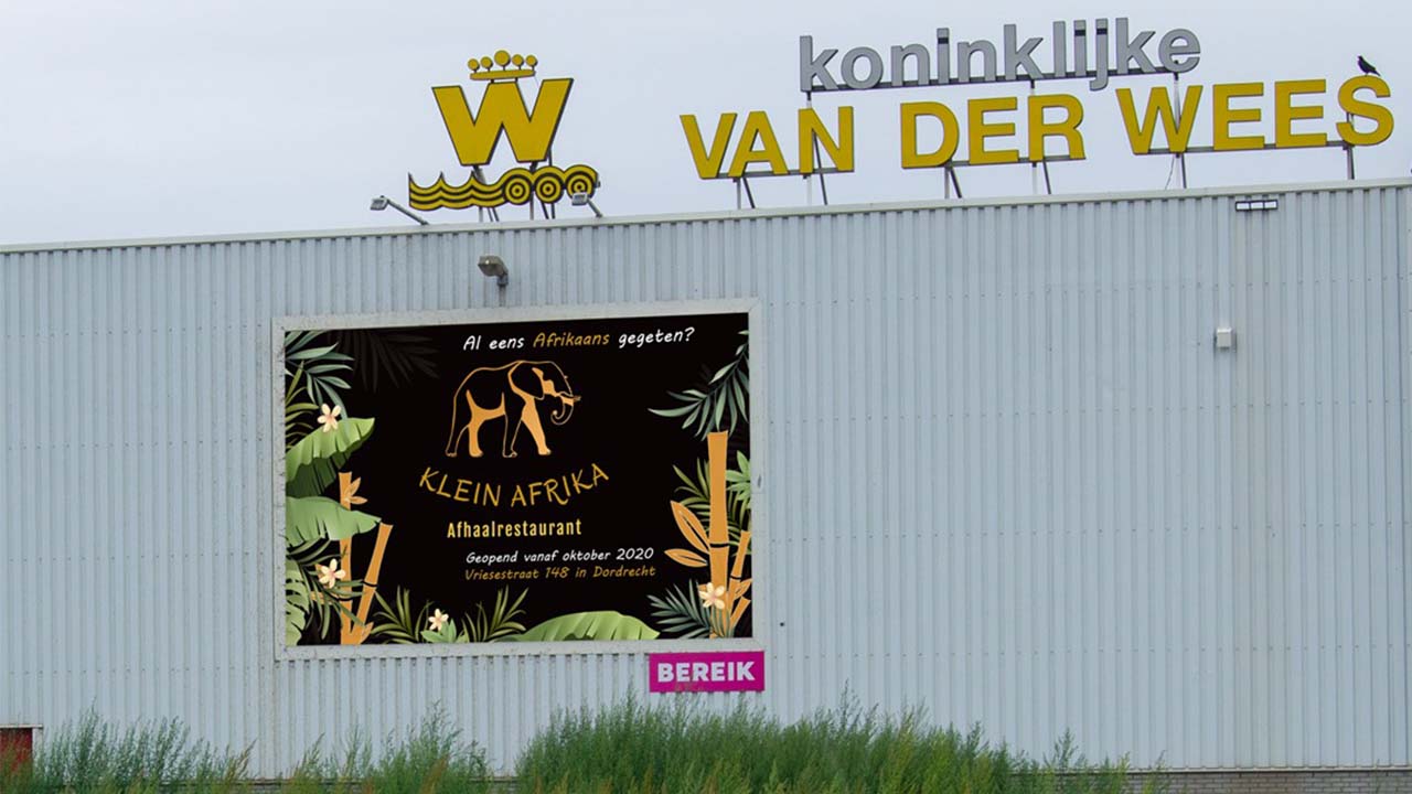 Picture of a billboard with my design for the takeaway restaurant Klein-Afrika